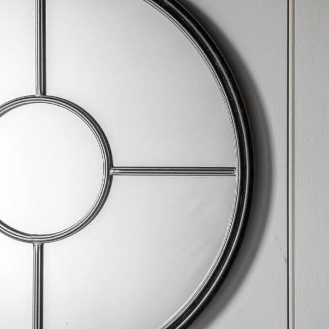 Coco Black & Silver Large Round Window Mirror with industrial black and gold frame, 800mm diameter, adds style to any living space.