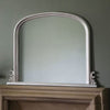 Elegant dome overmantle mirror in silver leaf finish, featuring bevelled glass design, dimensions 94 x 118cm.