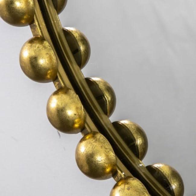 Gold Pill mirror with oversized beading and bold black finish, modern design ideal for stylish home decor.