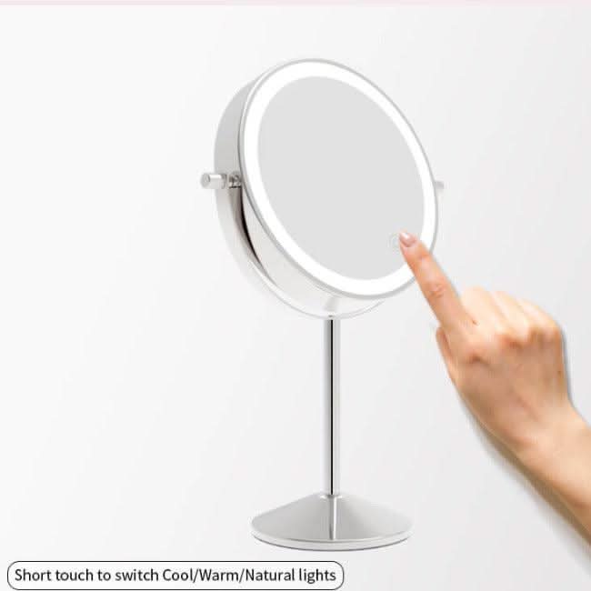 A hand touches the edge of the Illuminated Round Cosmetic Mirror Rechargeable Diameter 20cm, showing its touch control for switching between cool, warm, and natural light modes.