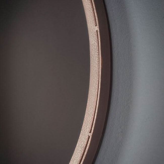 Close-up of large Broadway round mirror with metal frame and hanging strap, adding rustic flair to walls, dimensions: 510x915 mm.