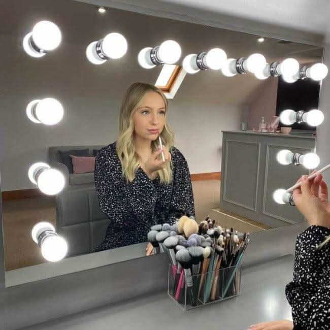 nicole mirror on bedroom wall illuminated