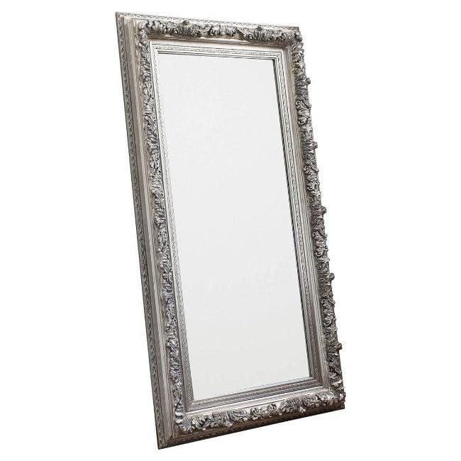 Silver ornate leaner full-length mirror in a bedroom setting with detailed frame, 173cm x 87cm, suitable for portrait or landscape orientation.